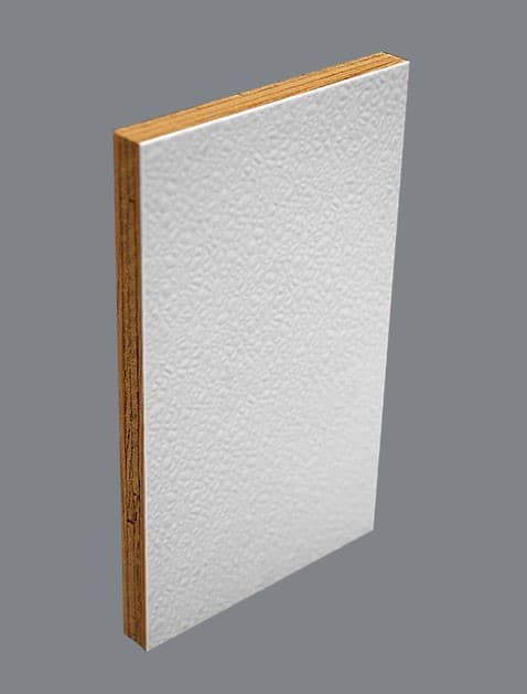 A panel stood on edge, a white pebbled fiberglass face bonded to a wood-strand substrate, the layer line visible down the cut edge.