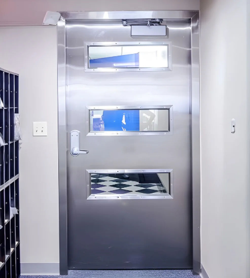 Stainless steel Jamocor swing door with three vision lites and an operator