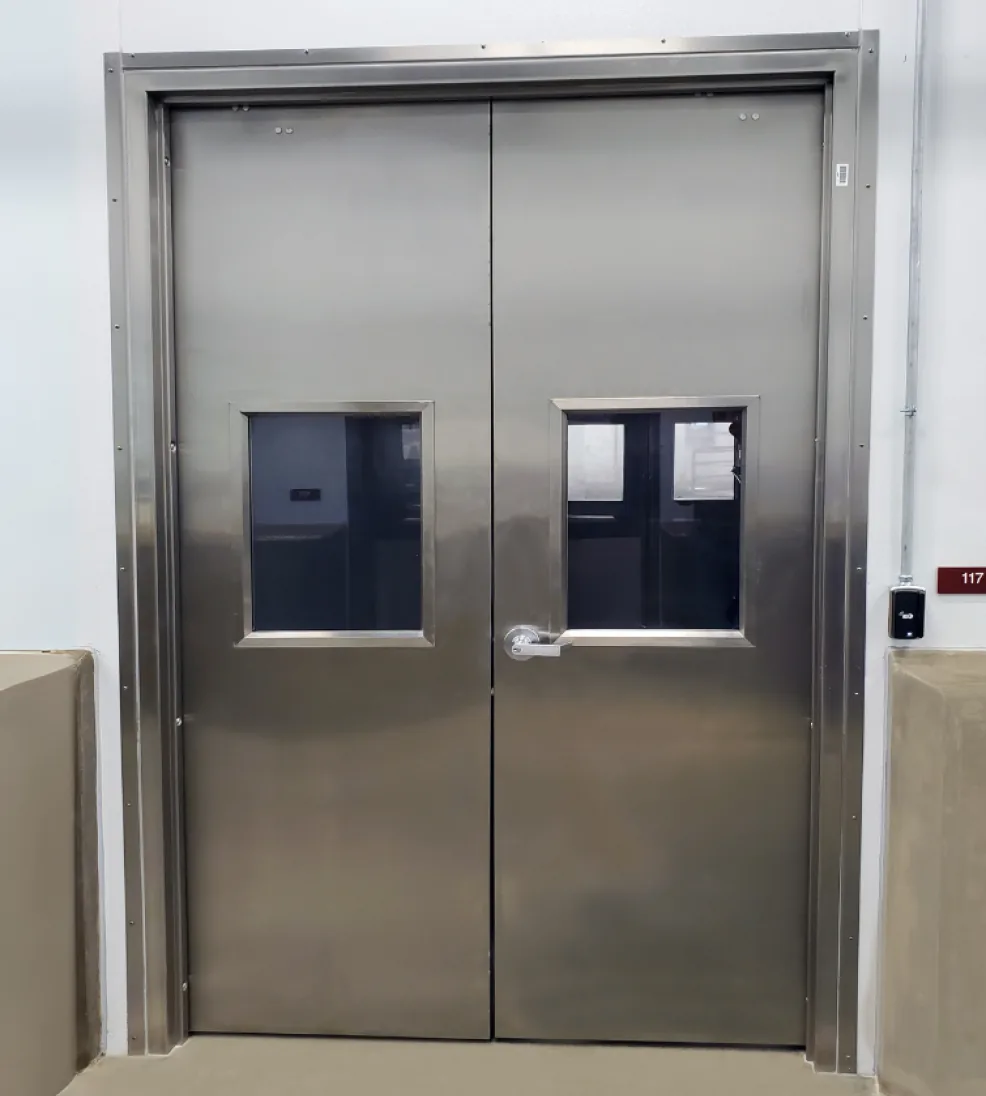 Stainless steel Jamocor double doors with vision lites in a stainless frame