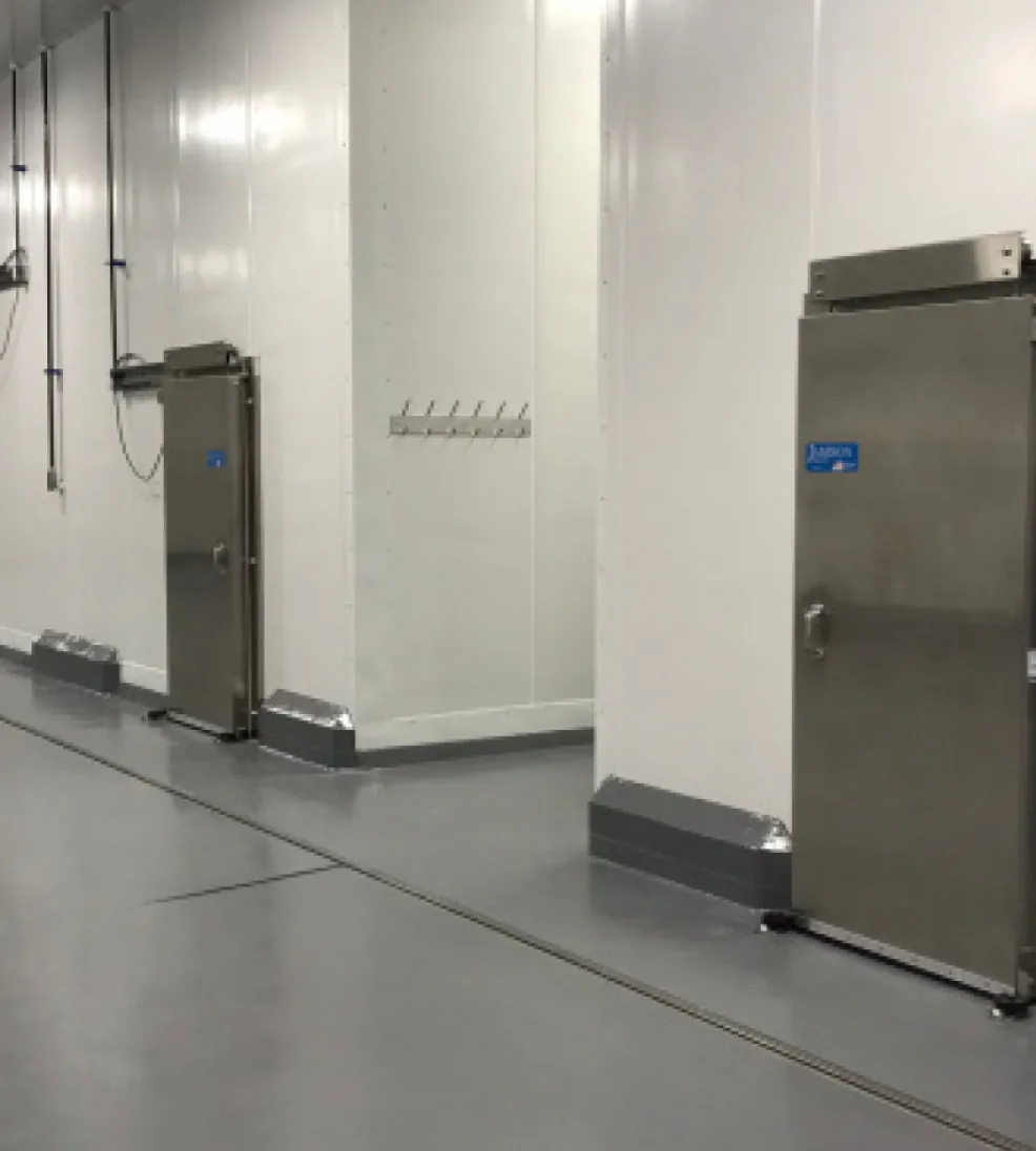 Stainless Jamofood sliding doors in a white food-processing corridor