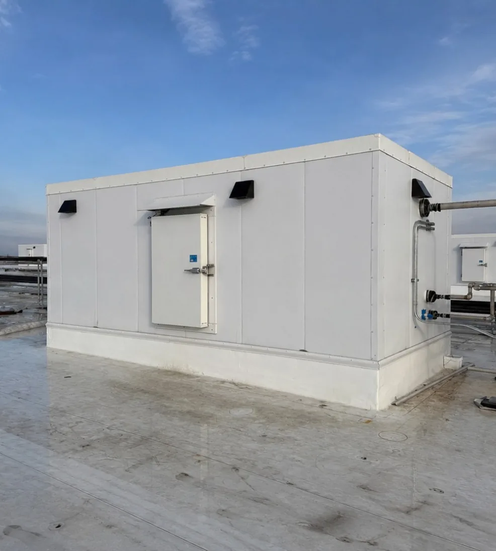 Jamoguard overlap swing door on a rooftop refrigeration penthouse built from insulated panels