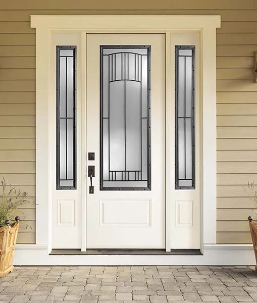 A white entry door with tall decorative glass and two matching sidelites