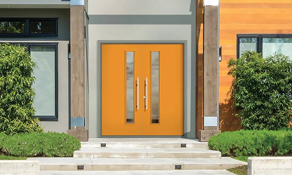 An orange modern double entry door with narrow vertical lites